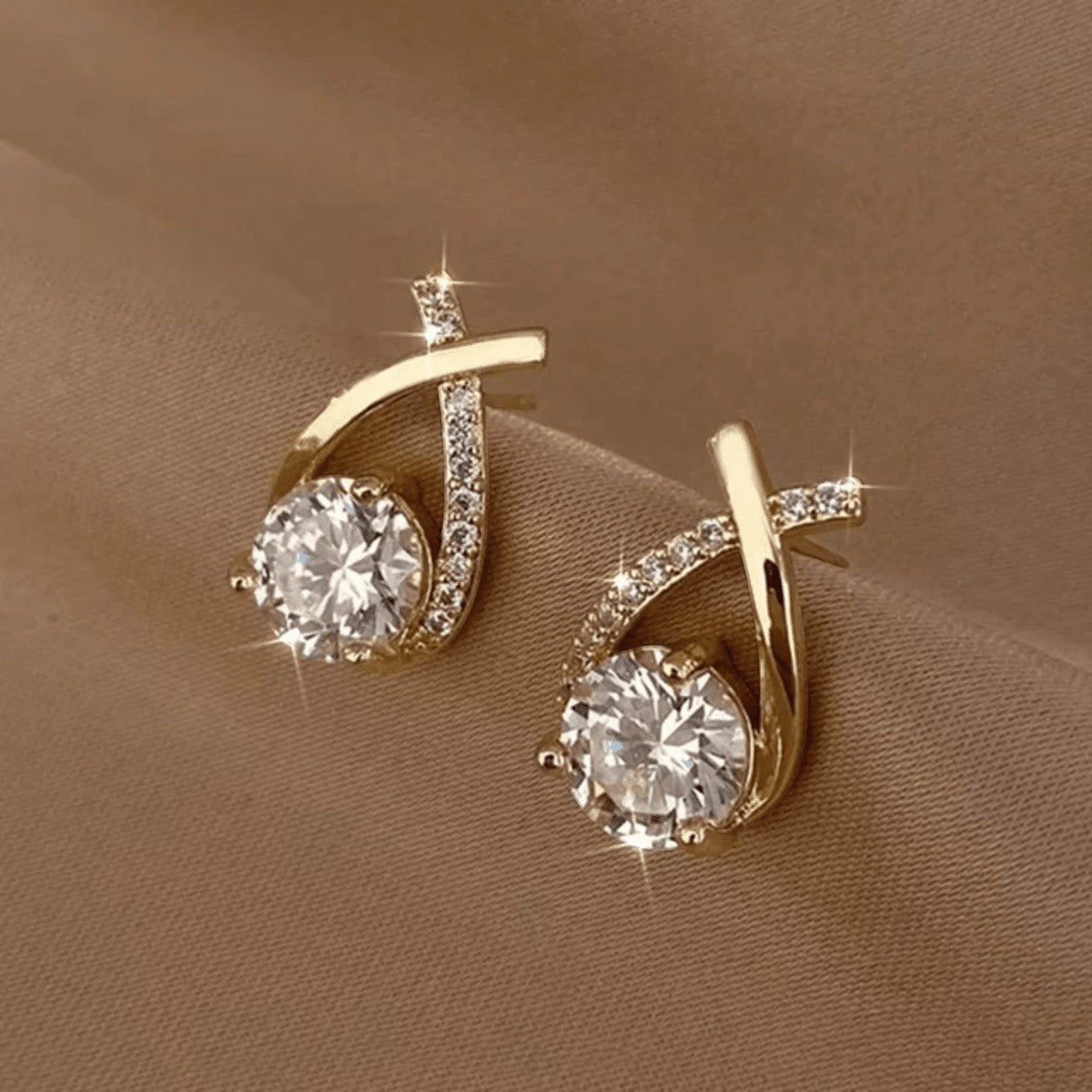TITLIYA gold-tone Korean earrings featuring a crystal-encrusted cross design with a large central sparkling stone.