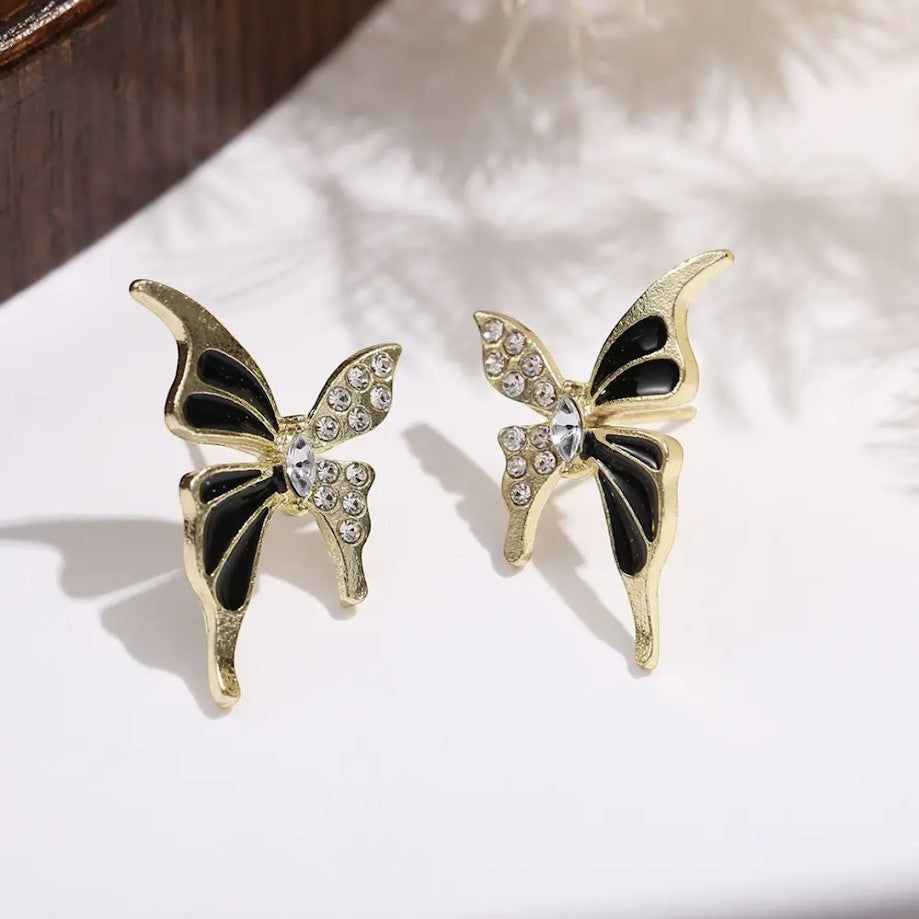 TITLIYA Enchanted Stud Butterfly Earrings in gold alloy with black enamel and sparkling crystal stone accents.