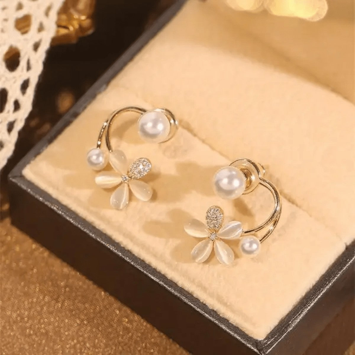 TITLIYA gold-tone Korean earrings featuring a flower design with opal-style petals, crystal accents, and white pearls.