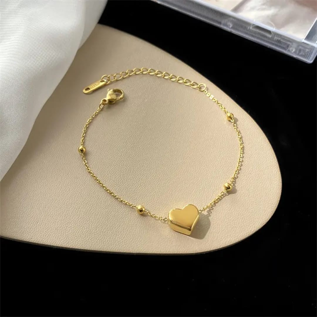 TITLIYA delicate gold heart charm bracelet with dainty bead accents on a fine adjustable chain for minimalist style.