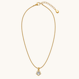 TITLIYA gold-tone fine chain necklace featuring a delicate mini four-leaf clover pendant with clear stone detailing.