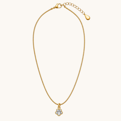 TITLIYA gold-tone fine chain necklace featuring a delicate mini four-leaf clover pendant with clear stone detailing.