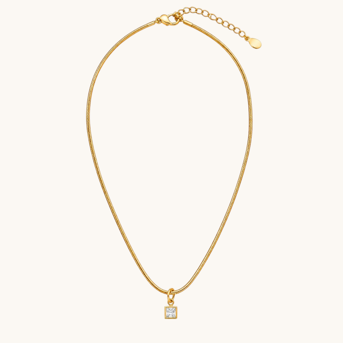 TITLIYA gold-tone fine chain necklace featuring a delicate square crystal pendant with clear stone detailing.