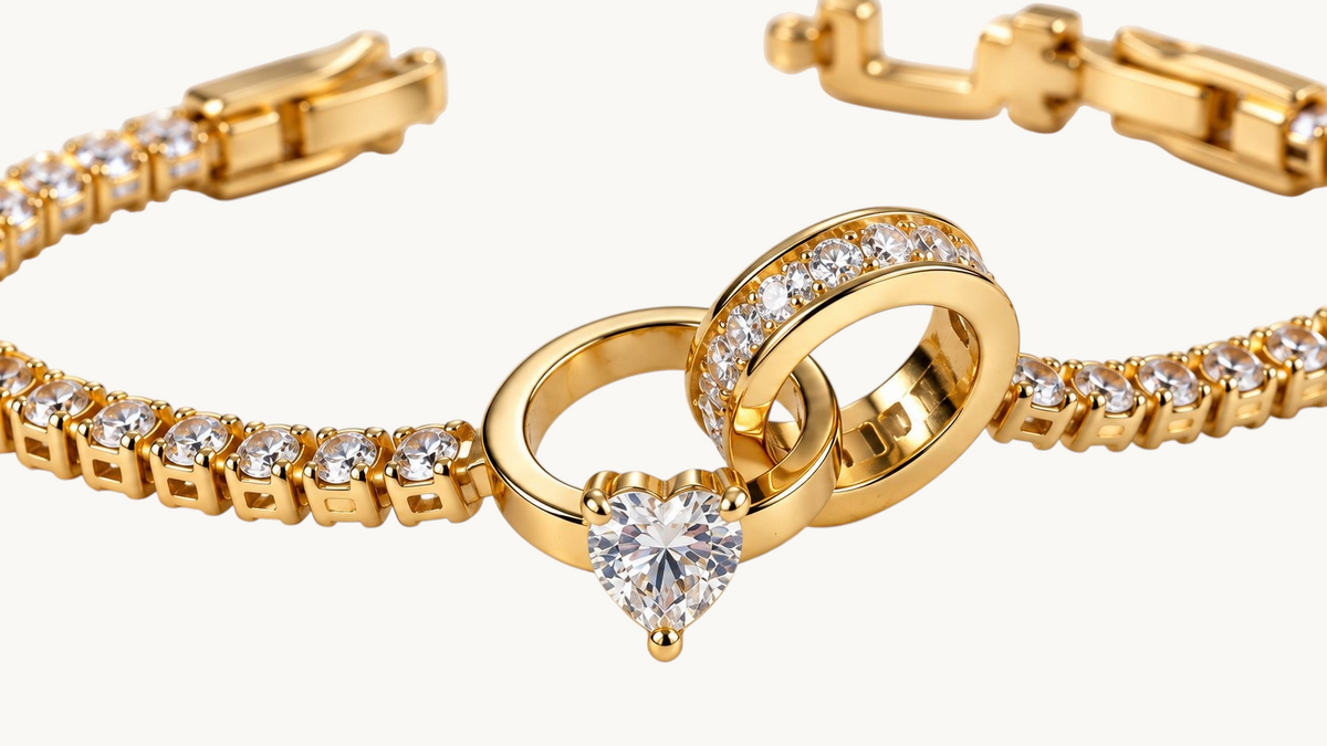 TITLIYA gold-tone crystal link bracelet featuring an elegant heart-shaped clear stone centerpiece and circular accents.