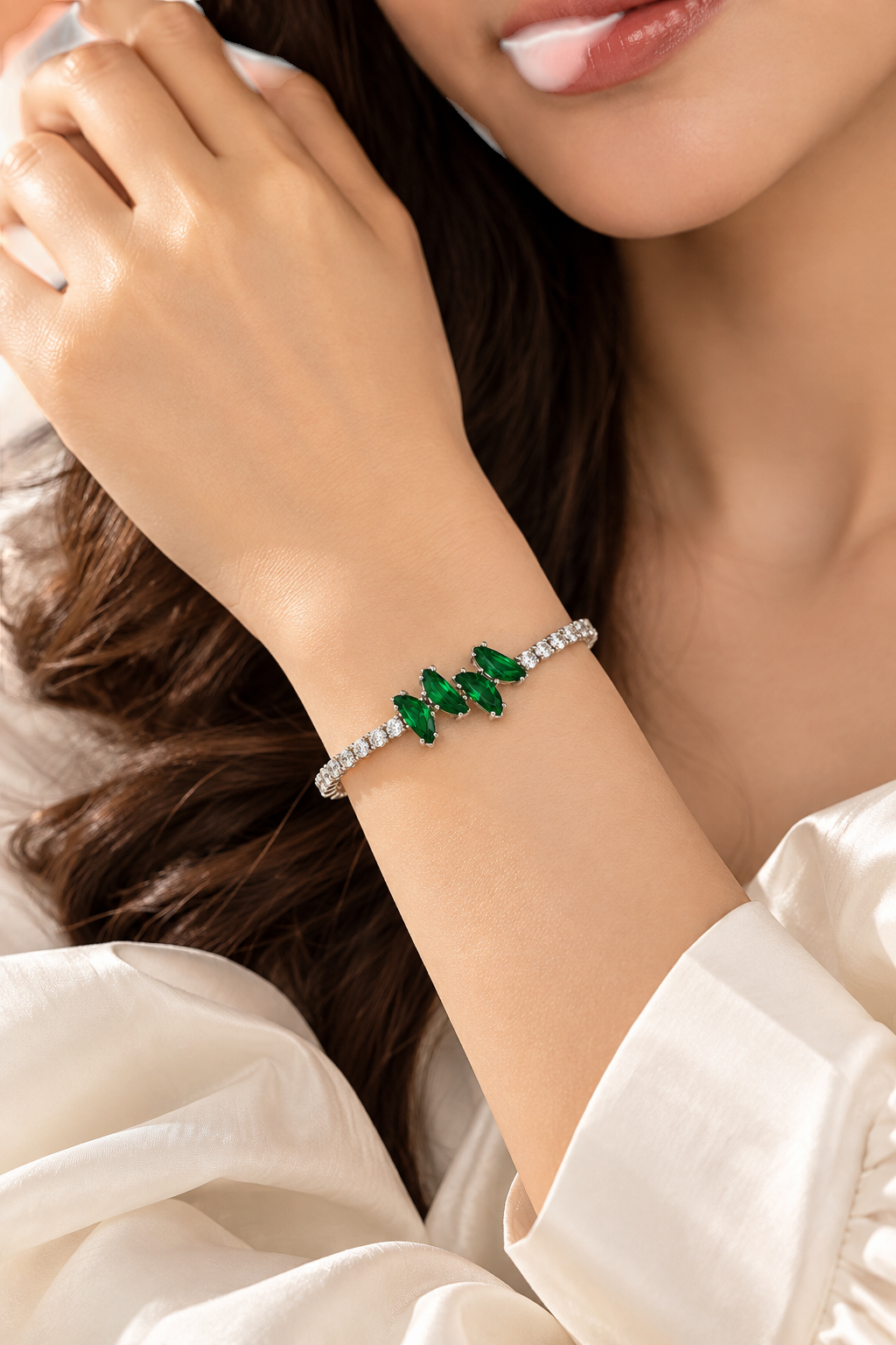 TITLIYA silver-tone link bracelet featuring marquise-cut green crystals on a woman's wrist