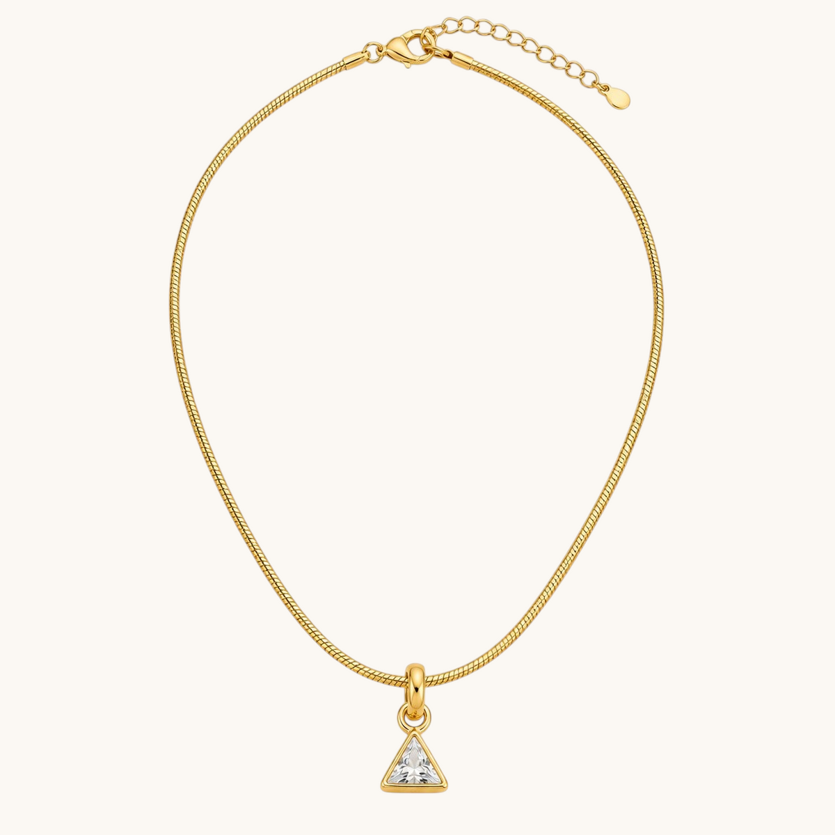 TITLIYA gold-tone fine chain necklace with a minimalist triangle pendant featuring a sparkling clear crystal stone.
