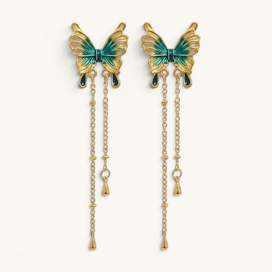 TITLIYA gold-tone butterfly drop earrings with ocean blue enamel detailing and delicate hanging chain accents.