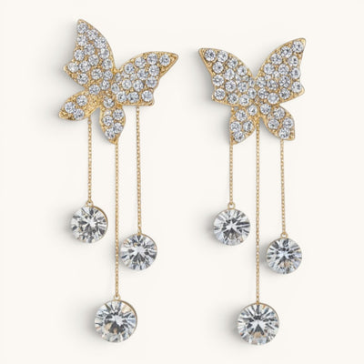 TITLIYA gold-tone Korean style butterfly dangle earrings with sparkling crystal accents and delicate chain drops.