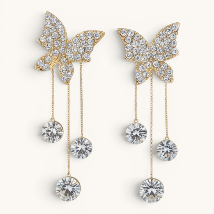 TITLIYA gold-tone Korean style butterfly dangle earrings with sparkling crystal accents and delicate chain drops.