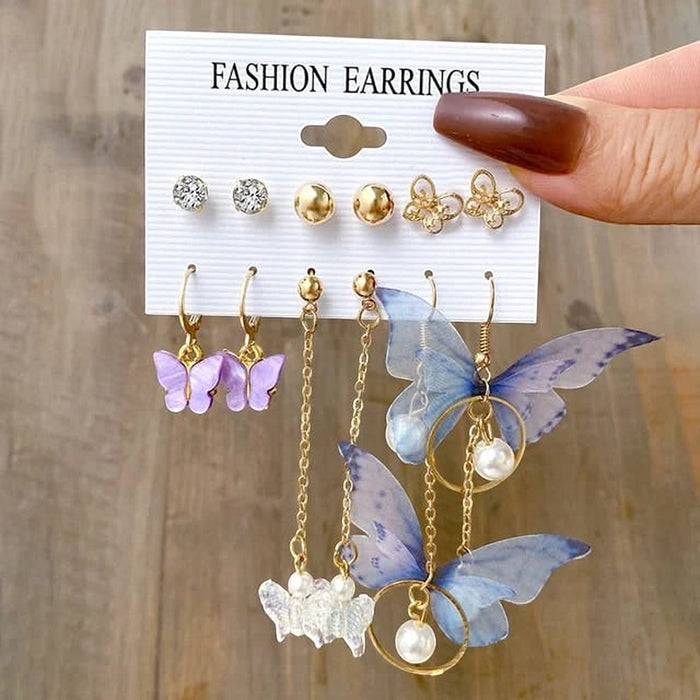 TITLIYA set of 6 Korean butterfly drop earrings featuring purple and blue butterfly charms, pearls, and gold chains.