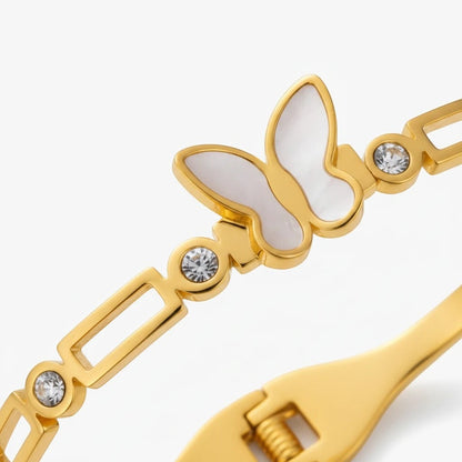TITLIYA gold-plated bracelet featuring a white pearlescent butterfly motif and sparkling crystal accents.