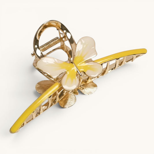 TITLIYA gold-tone butterfly hair claw clip with vibrant yellow enamel wings and a polished metallic finish.