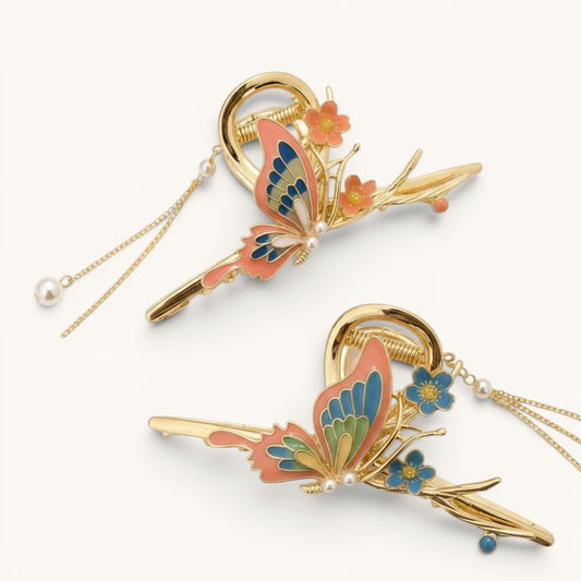 TITLIYA gold metal butterfly hair clips with enamel wings, floral accents, and delicate dangling pearl chains.