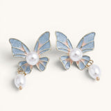 TITLIYA butterfly drop earrings with blue and pink enamel wings, lustrous pearl centers, and dangling pearl accents.