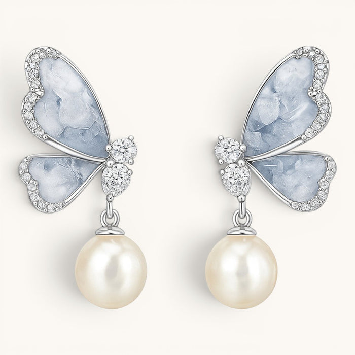 TITLIYA drop butterfly earrings for girls featuring light blue artificial stones, clear crystals, and white pearls.