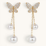 TITLIYA gold-tone butterfly earrings with sparkling crystals and dangling white pearl drops in a Korean design.