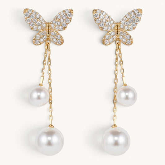 TITLIYA gold-tone butterfly earrings with sparkling crystals and dangling white pearl drops in a Korean design.