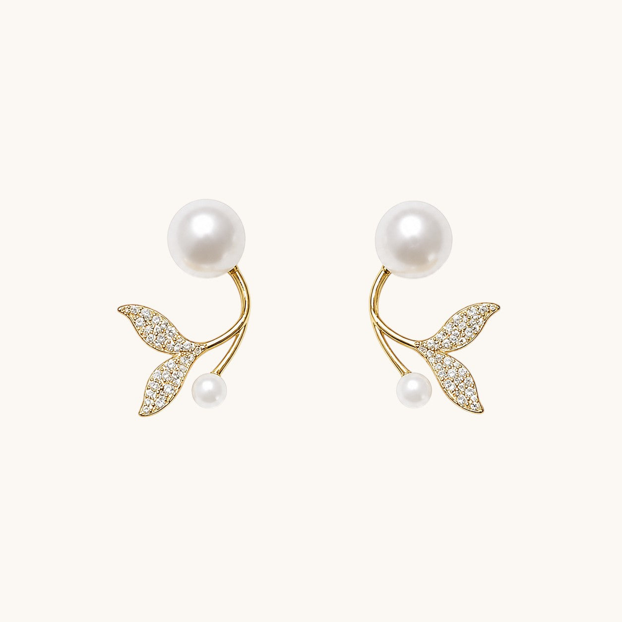 TITLIYA gold-tone butterfly earrings with white pearls and sparkling crystal accents for elegant daily wear.