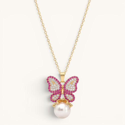 TITLIYA gold-tone alloy butterfly pendant necklace with pink and white crystals and a dangling white pearl charm.