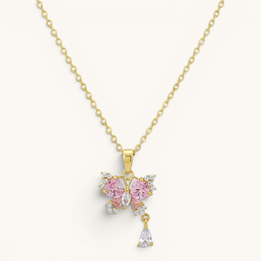 TITLIYA gold-tone butterfly pendant necklace with pink and clear crystals and a dangling teardrop charm.