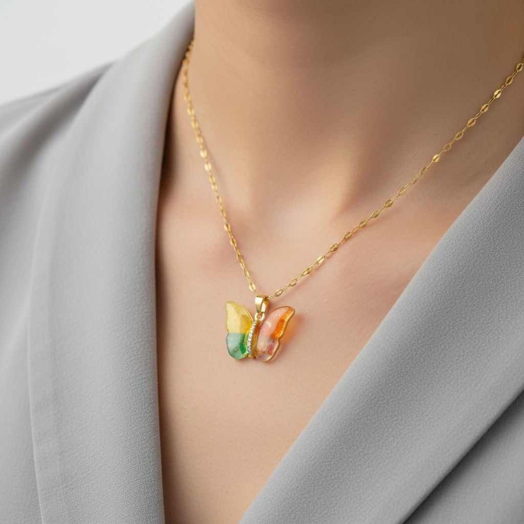 TITLIYA colourful butterfly pendant on a gold chain worn by a girl, featuring vibrant alloy wings and a polished finish