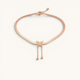 TITLIYA rose gold-toned snake chain necklace featuring a textured butterfly pendant with two dainty drop bead chains.