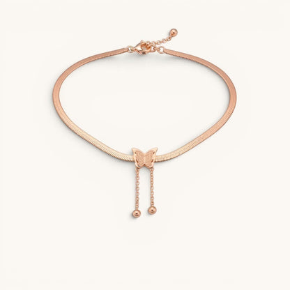 TITLIYA rose gold-toned snake chain necklace featuring a textured butterfly pendant with two dainty drop bead chains.