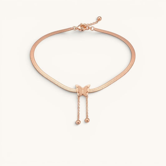 TITLIYA rose gold-toned snake chain necklace featuring a textured butterfly pendant with two dainty drop bead chains.