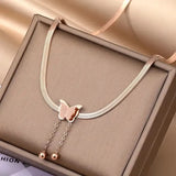 TITLIYA rose gold-toned snake chain necklace with a textured butterfly pendant and two dainty drop bead chains.