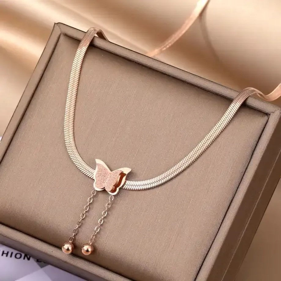 TITLIYA rose gold-toned snake chain necklace with a textured butterfly pendant and two dainty drop bead chains.