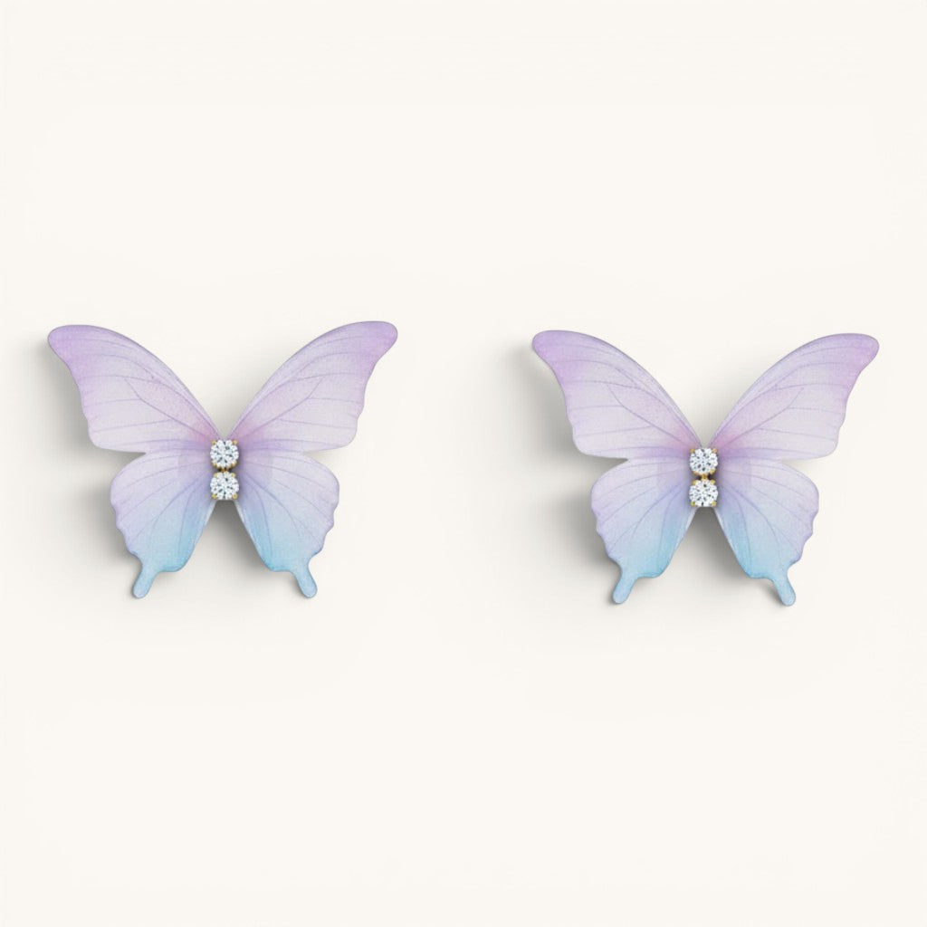 TITLIYA feather-light butterfly stud earrings in pastel purple and blue gradient with sparkling crystal accents.
