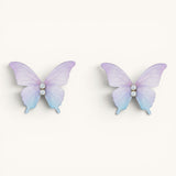 TITLIYA feather-light butterfly stud earrings in pastel purple and blue gradient with sparkling crystal accents.