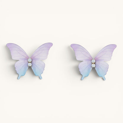 TITLIYA feather-light butterfly stud earrings in pastel purple and blue gradient with sparkling crystal accents.
