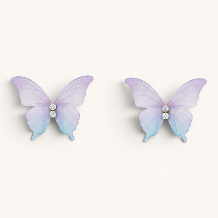 TITLIYA feather-light butterfly stud earrings in pastel purple and blue gradient with sparkling crystal accents.