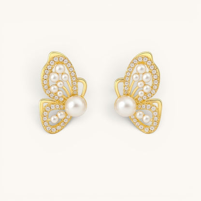 TITLIYA gold butterfly wing stud earrings featuring white pearls and sparkling crystals in a premium Korean style.
