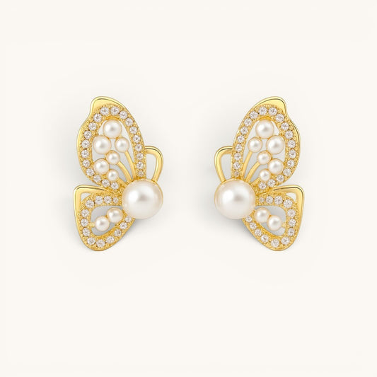 TITLIYA gold butterfly wing stud earrings featuring white pearls and sparkling crystals in a premium Korean style.