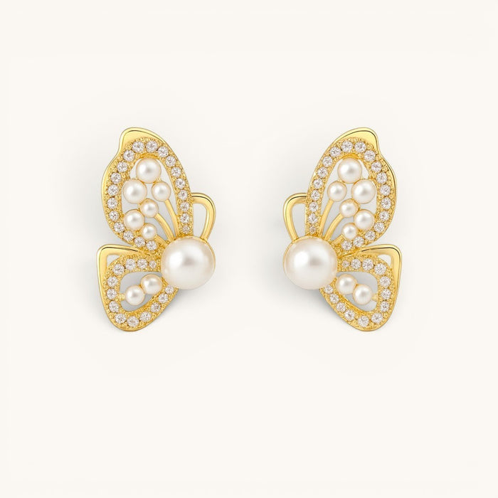 TITLIYA gold butterfly wing stud earrings featuring white pearls and sparkling crystals in a premium Korean style.