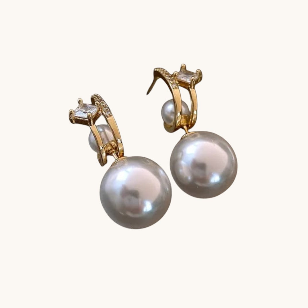 TITLIYA gold-tone Korean earrings featuring a crystal cross accent and a large white pearl drop for elegant style.