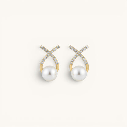 TITLIYA gold-tone cross stud earrings featuring sparkling diamond accents and a lustrous white pearl drop.