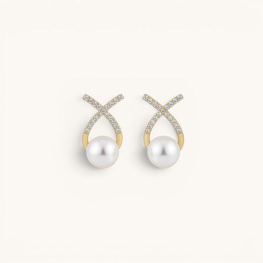 TITLIYA gold-tone cross stud earrings featuring sparkling diamond accents and a lustrous white pearl drop.