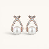 TITLIYA rose gold double cross earrings featuring sparkling crystals and a central white pearl for elegant daily wear.