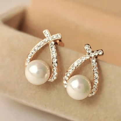 TITLIYA double cross earrings featuring white pearls and sparkling crystals in a rose gold tone setting.