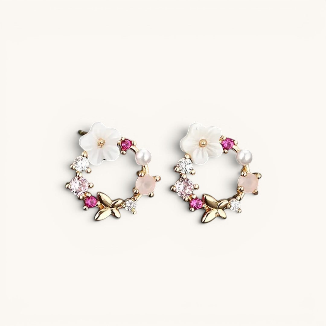 TITLIYA mini flower and butterfly hoop earrings with pink crystals, white petals, and pearls in gold-tone metal.