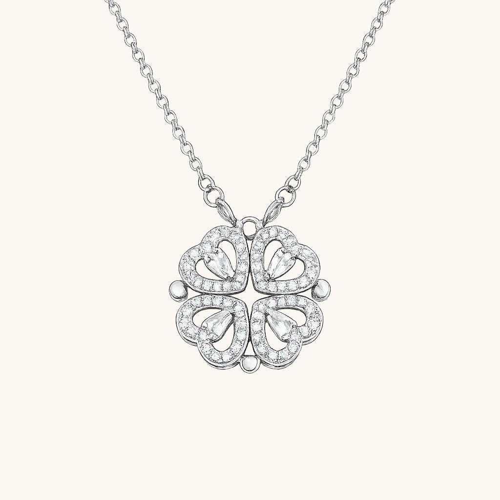 TITLIYA silver magnetic pendant necklace featuring four heart-shaped clover leaves with sparkling crystal accents.