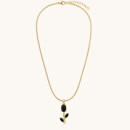TITLIYA gold-tone snake chain necklace featuring a black tulip pendant with an oval stone and leaf-shaped accents.
