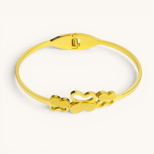 TITLIYA premium gold plated butterfly bracelet with a polished hinge clasp and textured butterfly charm design.