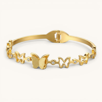 TITLIYA gold-tone bracelet featuring multiple butterfly motifs and small crystal accents for a festive look.