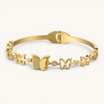 TITLIYA gold-tone bracelet featuring multiple butterfly motifs and small crystal accents for a festive look.