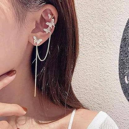 TITLIYA gold butterfly ear climber earrings with delicate chain dangles and sparkling crystal accents on a model.
