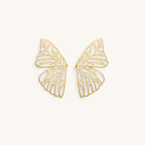 TITLIYA gold-plated butterfly wing hoop earrings with intricate filigree cut-out design on a neutral background.